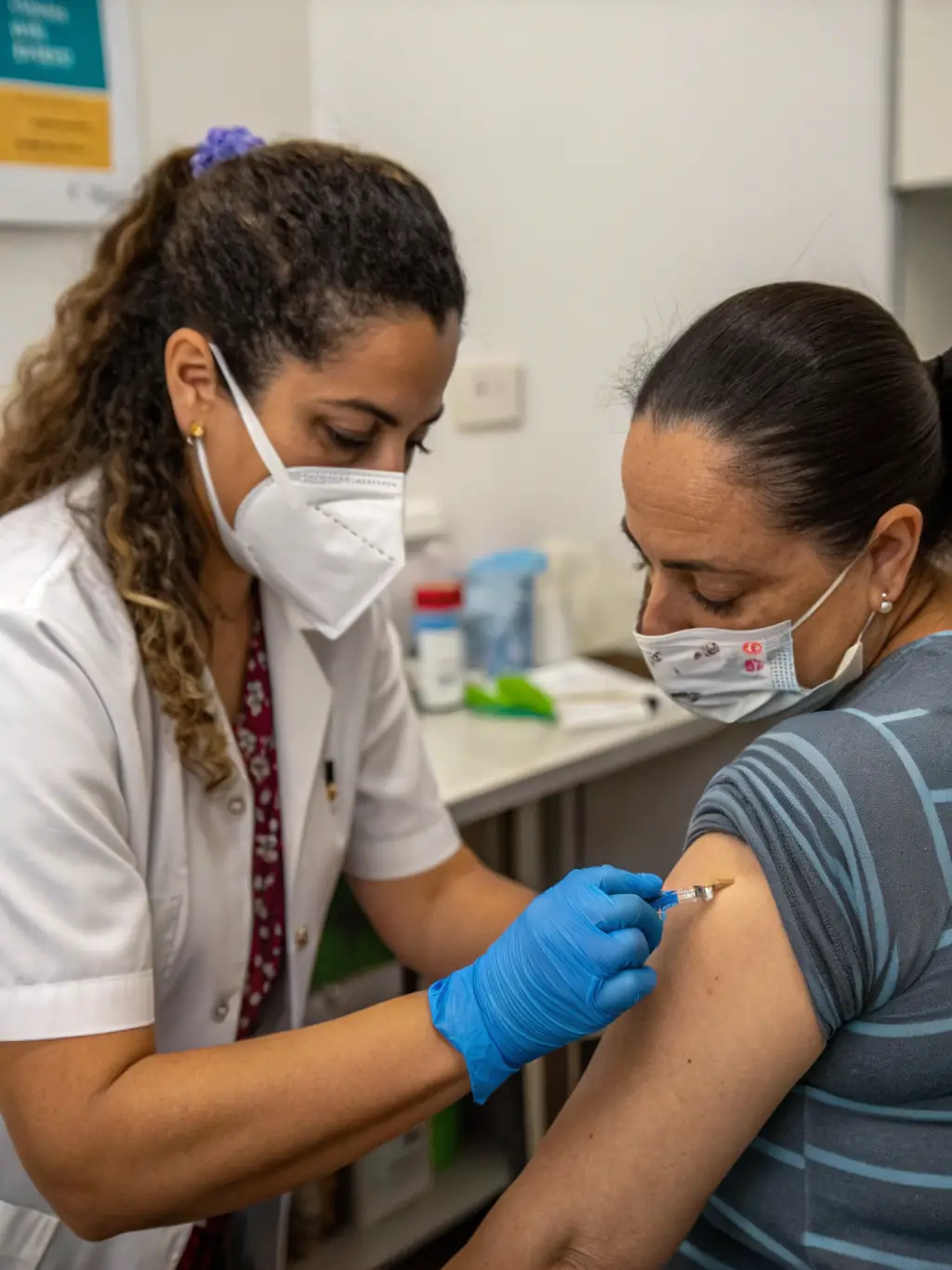 A healthcare professional administering preventive care, such as a vaccination, in a clean and modern clinic environment at Violet Health Beauty.